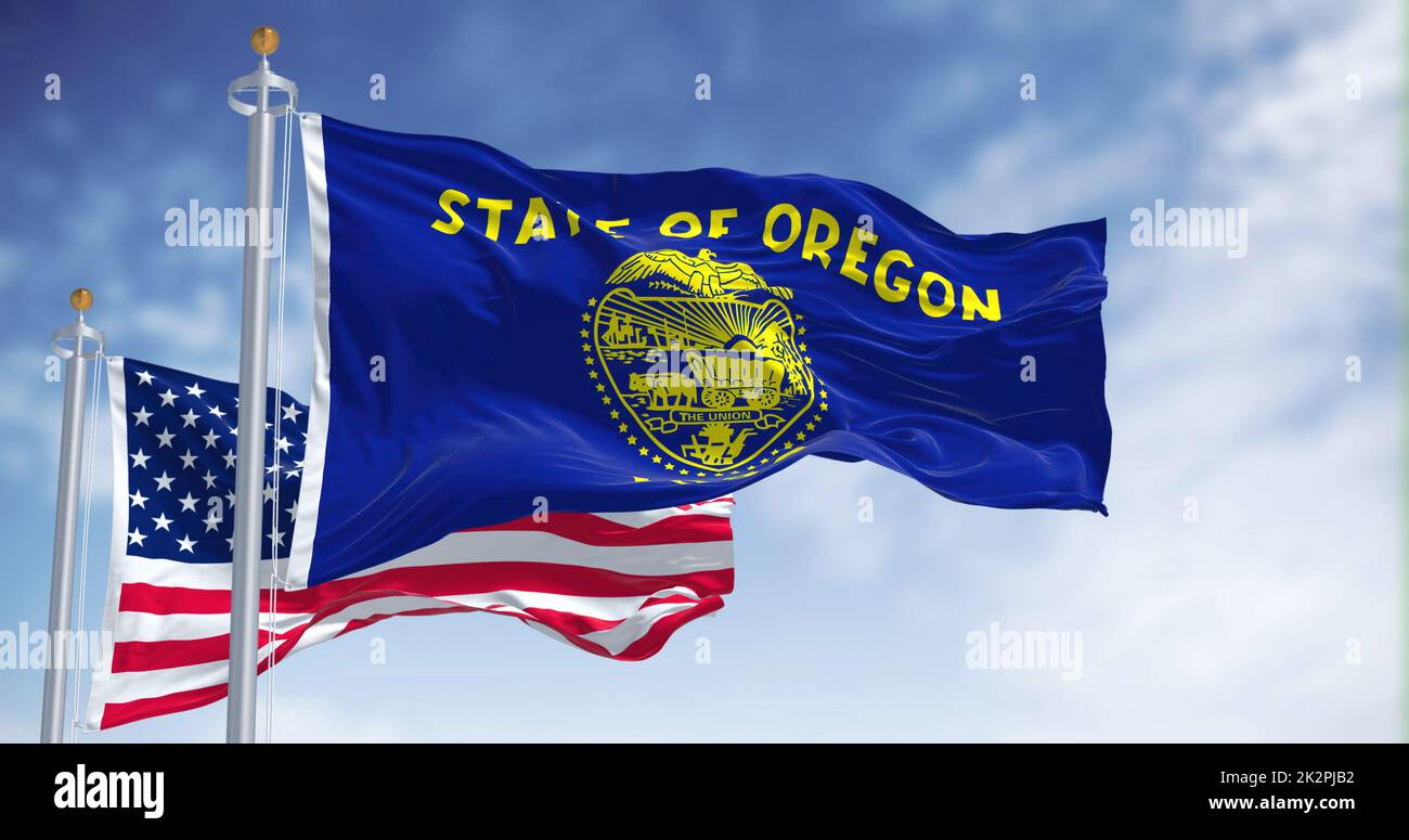 Le drapeau de l'État de l'Oregon agité avec le drapeau national des États-Unis d'Amérique Banque D'Images