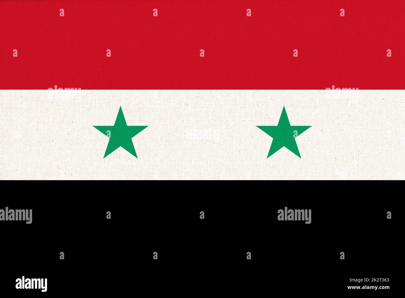 Drapeau de la Syrie. Drapeau syrien sur la texture du tissu. Symbole national de la Syrie Banque D'Images