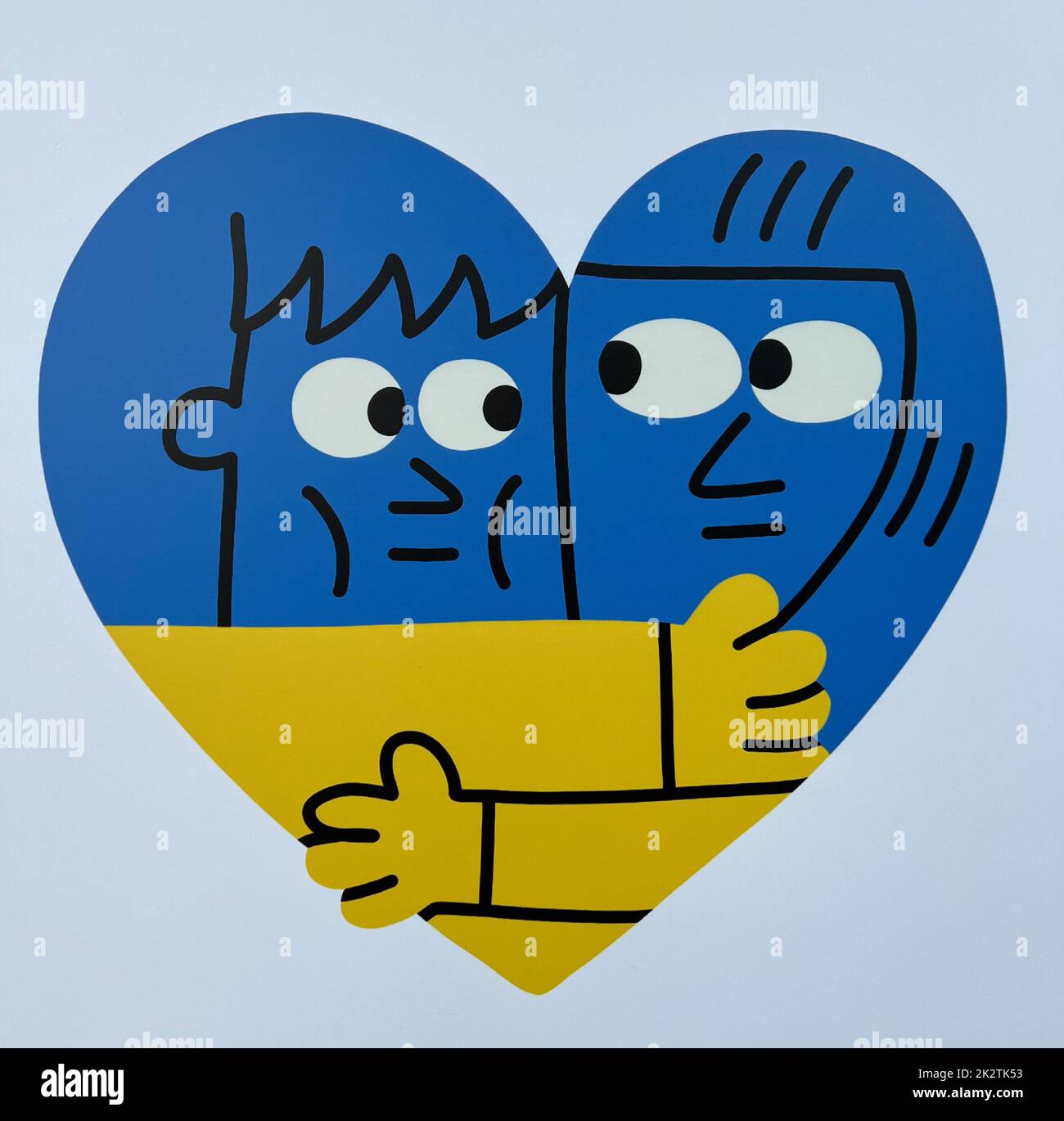 Un coeur aux couleurs nationales (drapeau national) de l'Ukraine avec deux visages se embrassent Banque D'Images