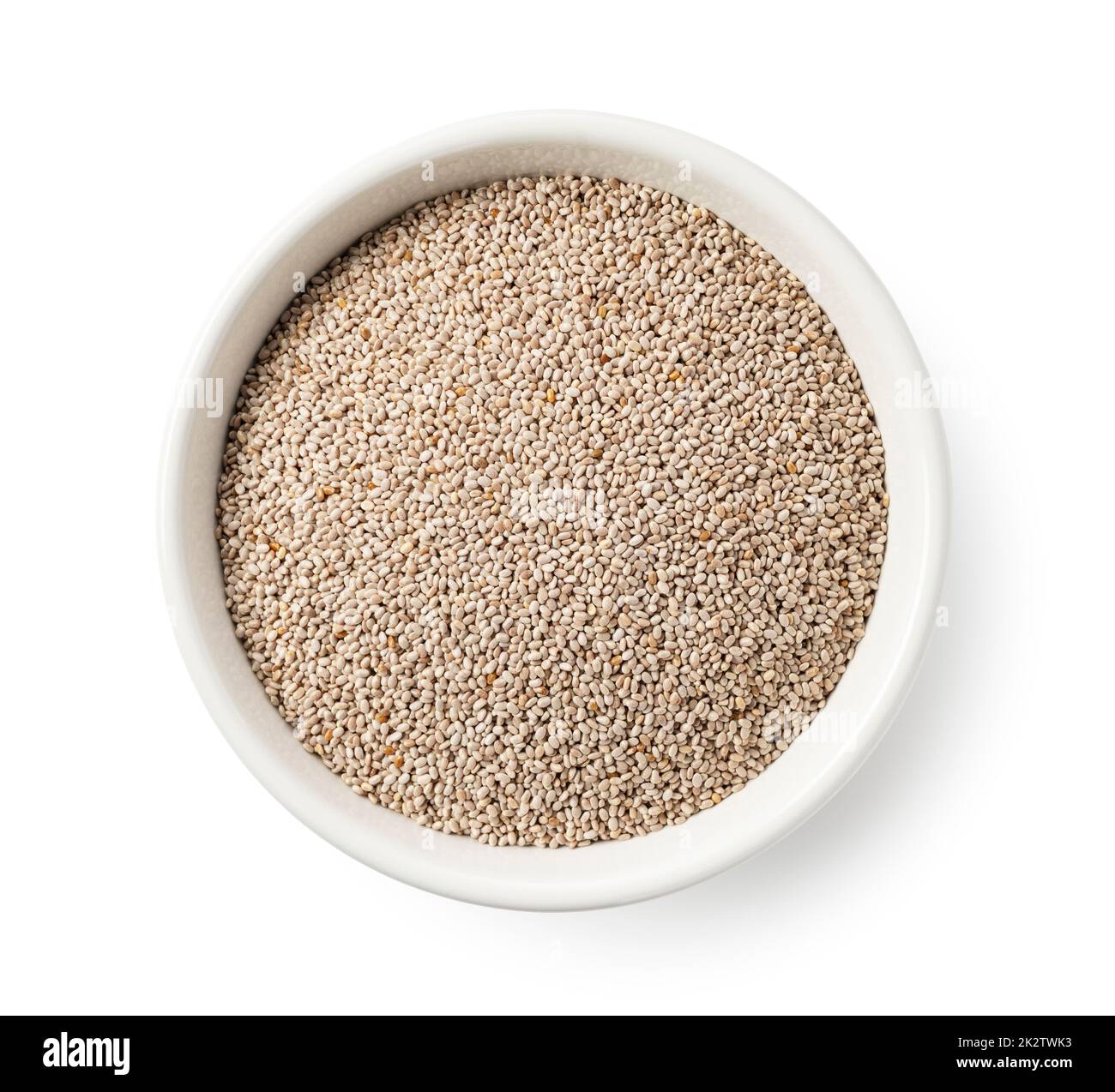 Graines de chia blanc dans un bol blanc sur fond blanc. Banque D'Images