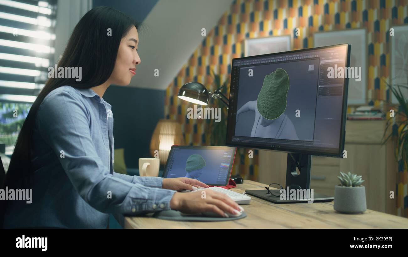 Femme asiatique 3D designer ayant un travail à distance sur 3D modélisation et la création 3D visualisation des vêtements en utilisant pc avec logiciel professionnel et tablette Banque D'Images