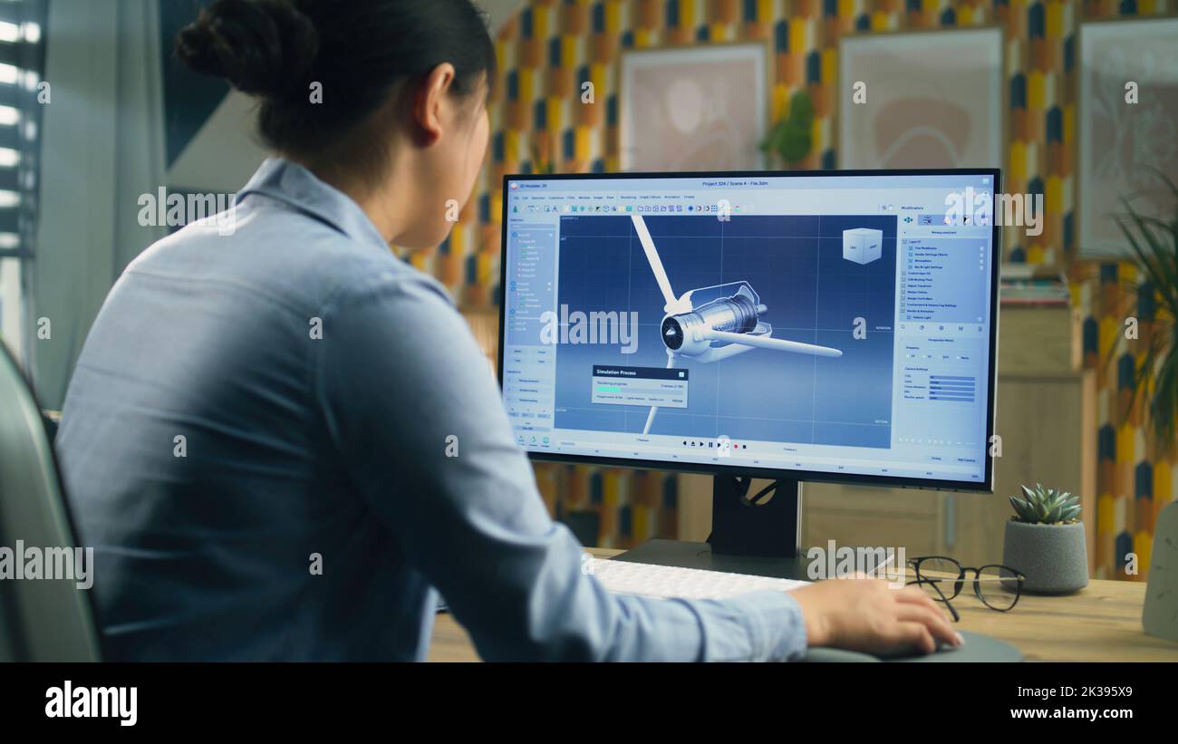 Une femme asiatique a dessiné une pièce de rechange d'éolienne 3D dans un programme professionnel de modélisation 3D sur pc tout en travaillant sur un projet au bureau à domicile Banque D'Images