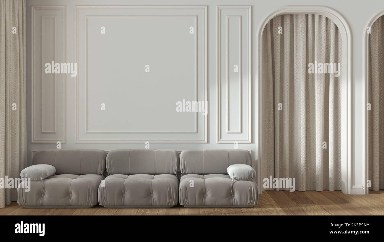 Salon néoclassique, murs moulés avec espace de copie, gabarit. Porte voûtée avec rideau et parquet. Tons blanc et beige, canapé moderne en velours. Banque D'Images