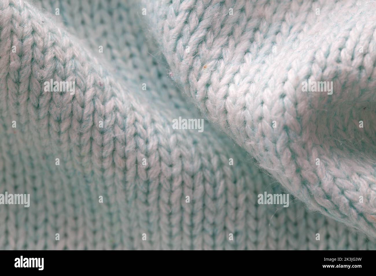 Matériau du pull gris chaud, macro d'arrière-plan Banque D'Images