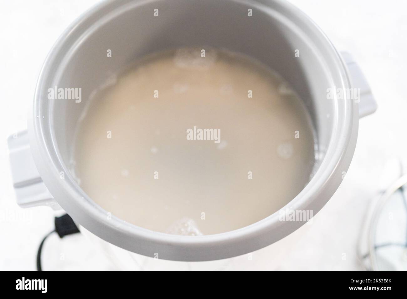 Cuisson du riz Banque D'Images Cuisson du riz Banque D'Images