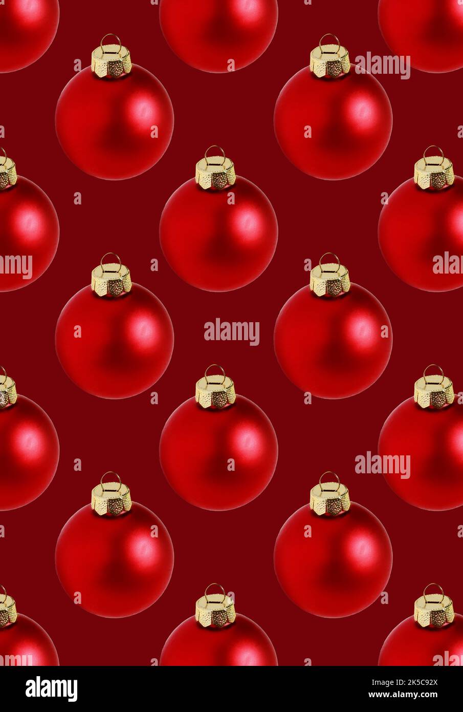 Motif de boules de Noël rouges sans couture sur fond rouge Banque D'Images