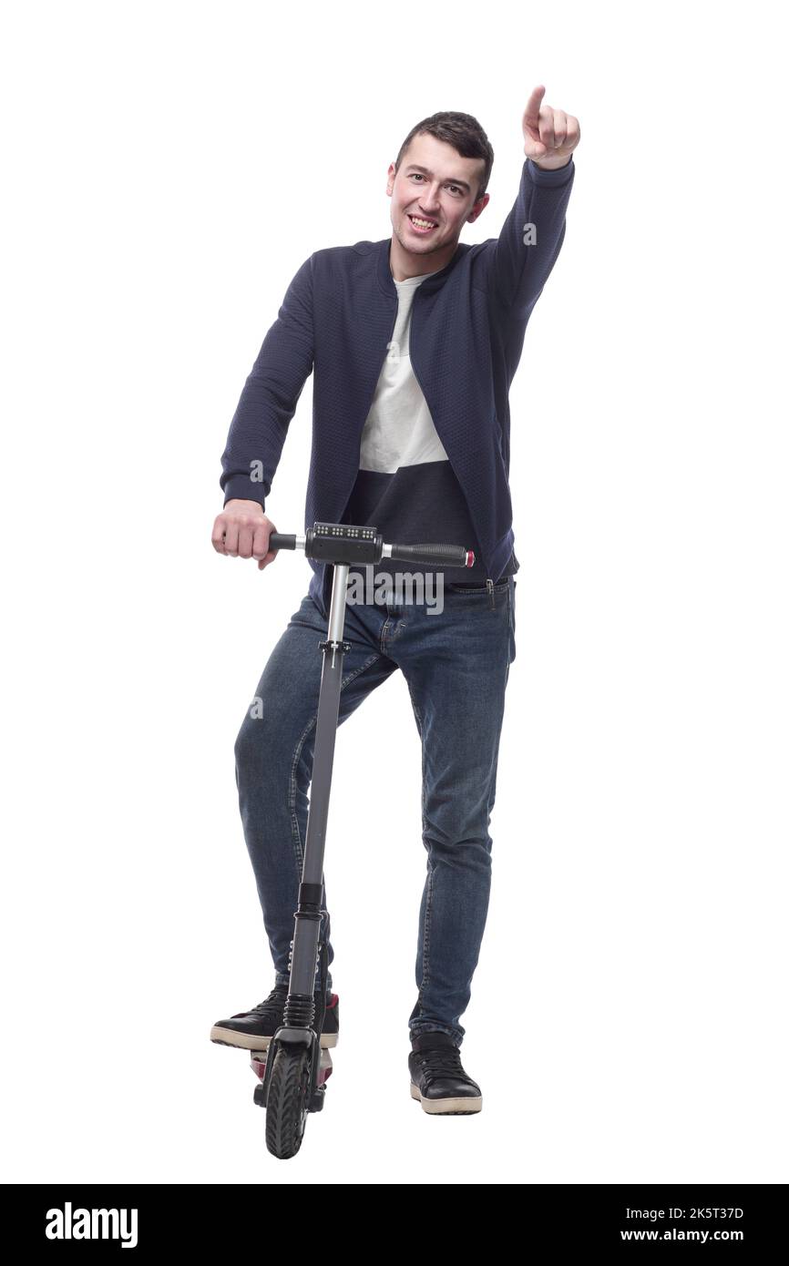 jeune homme souriant avec un scooter électrique . Banque D'Images