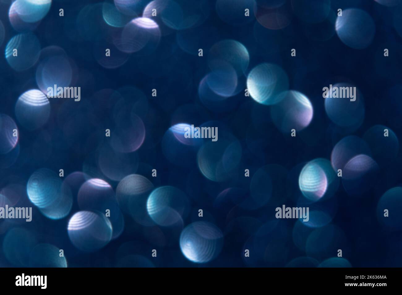 motif de cercle bleu spot sombre sur fond de bokeh clair Banque D'Images