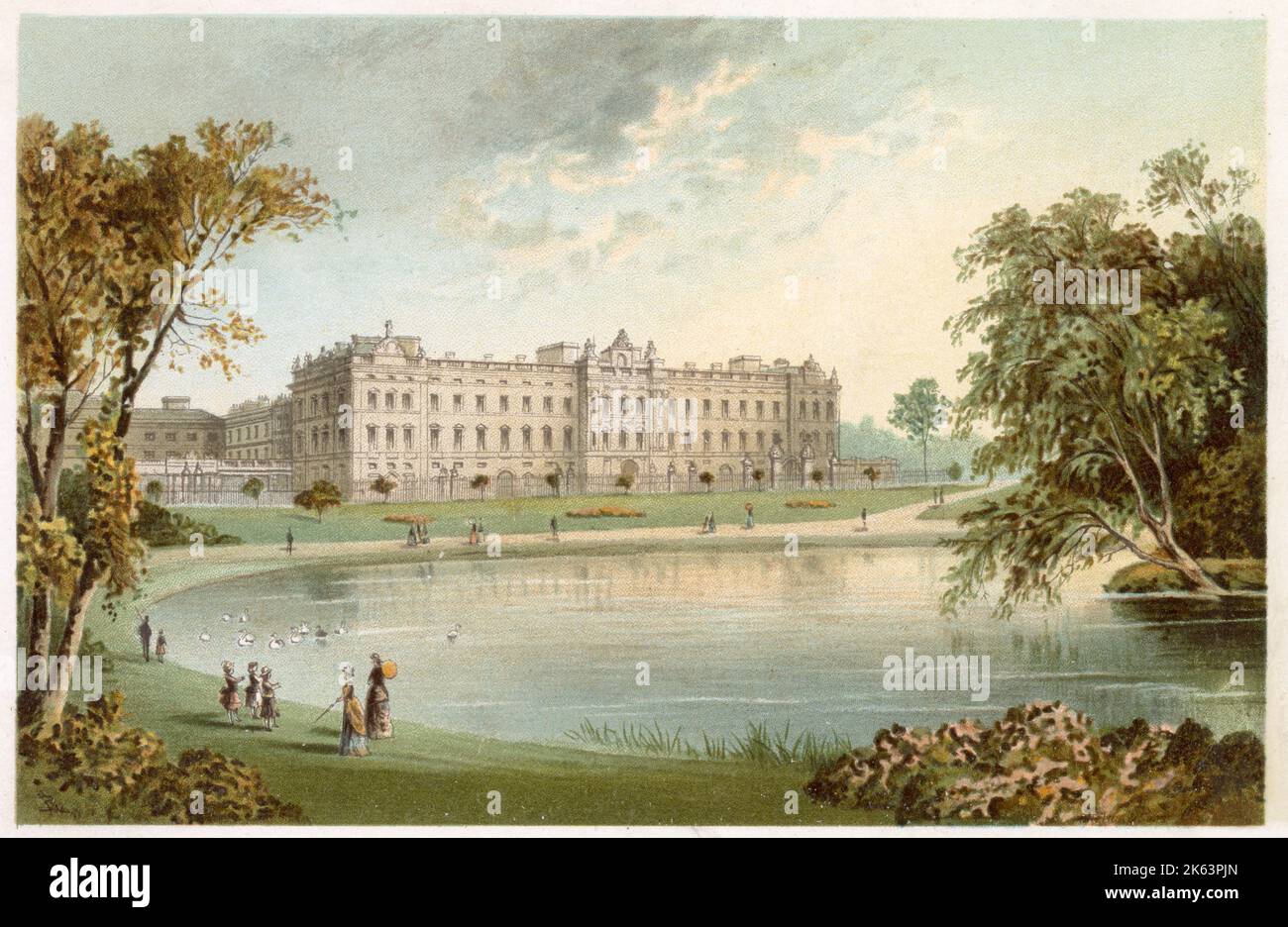 Vue sur Buckingham Palace de l'autre côté du lac dans St James' Park. Femme élégante et enfants se promènent au bord du lac. Banque D'Images