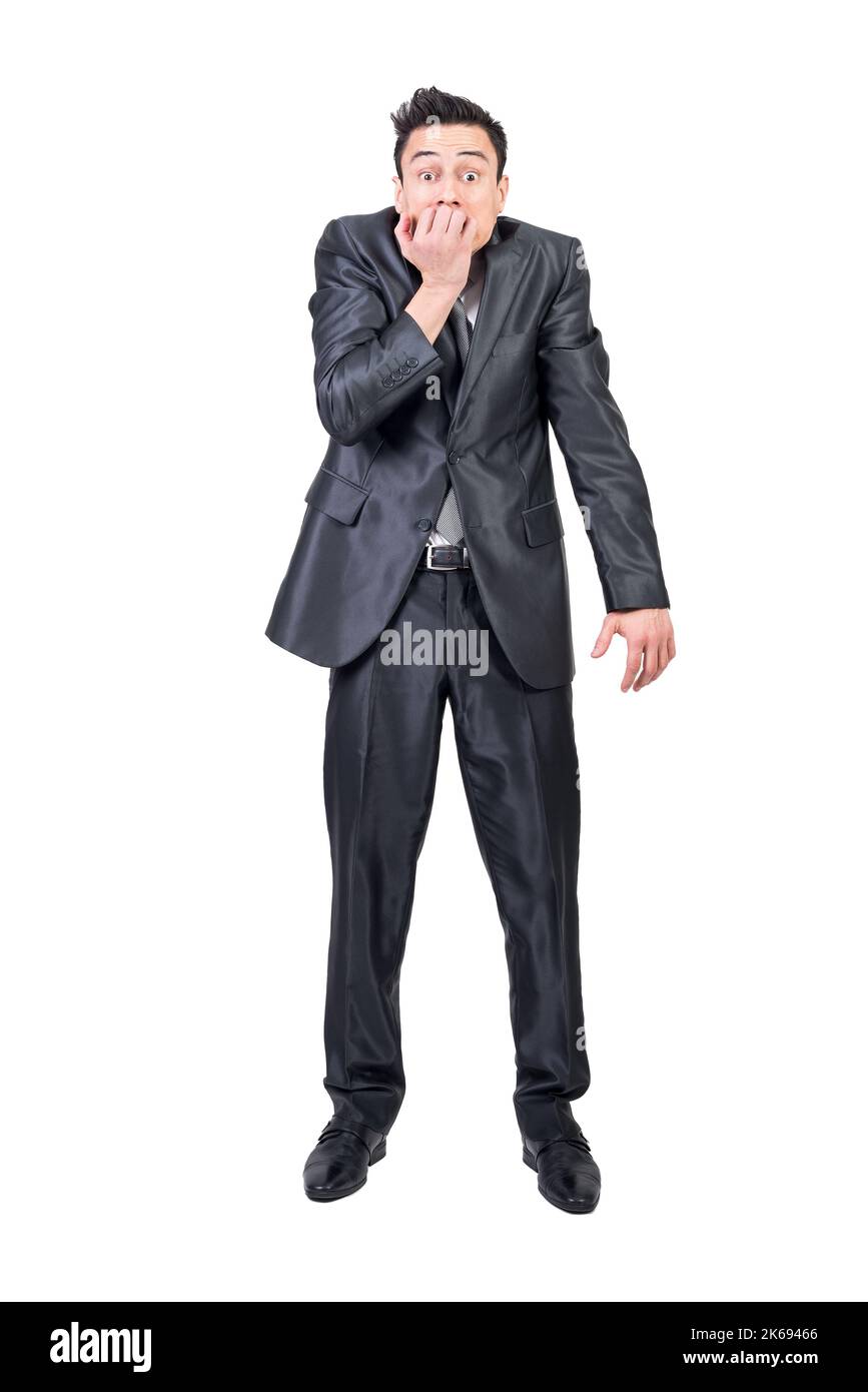 Homme d'affaires nerveux piquant les ongles en studio. Arrière-plan blanc. Banque D'Images