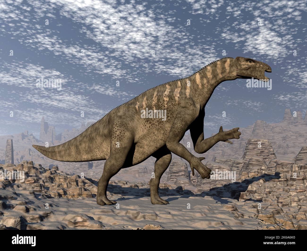 Dinosaure d'Iguanodon marchant sur un terrain accidenté. Banque D'Images