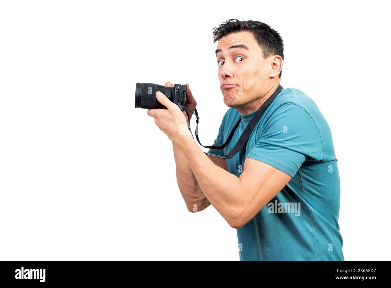 Photographe masculin avec appareil photo faisant des visages amusants Banque D'Images