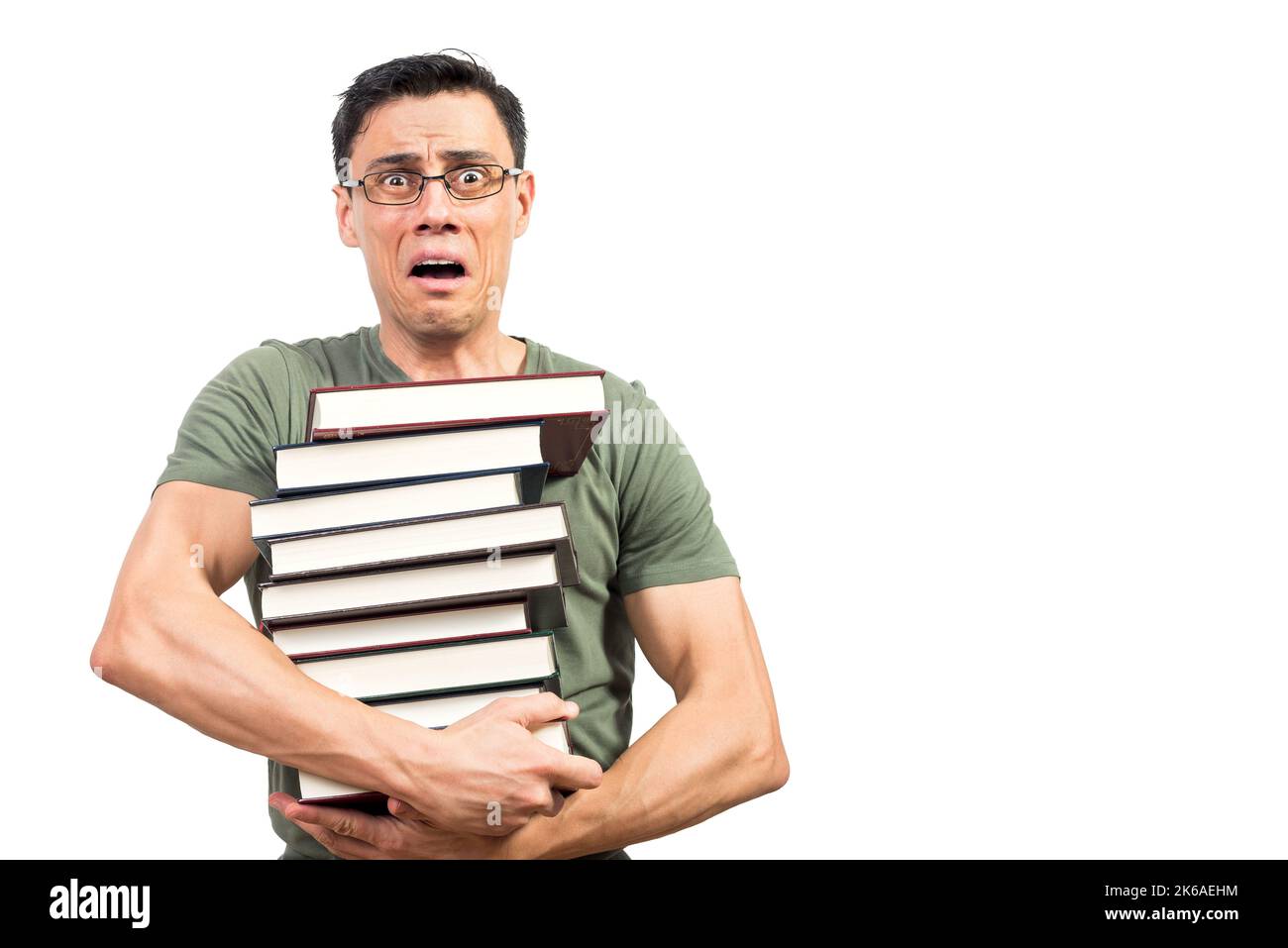 Un homme effrayant élève avec des livres regardant l'appareil photo Banque D'Images
