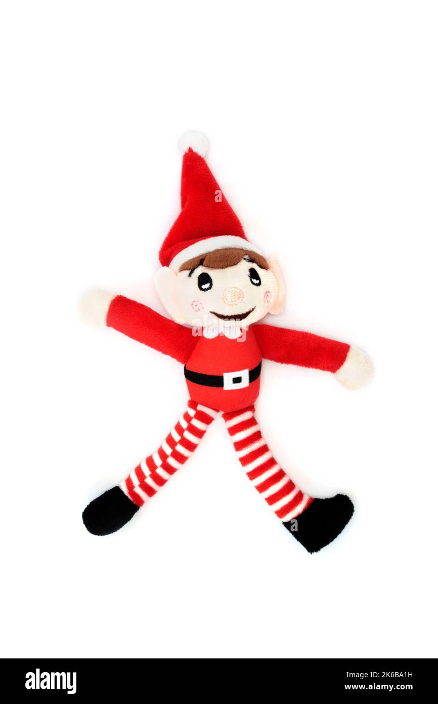 Noël Elf santa aide traditionnelle fête amusant décoration en rouge sur fond blanc. Jouet rétro pour la veille de Noël et les fêtes de fin d'année. Banque D'Images