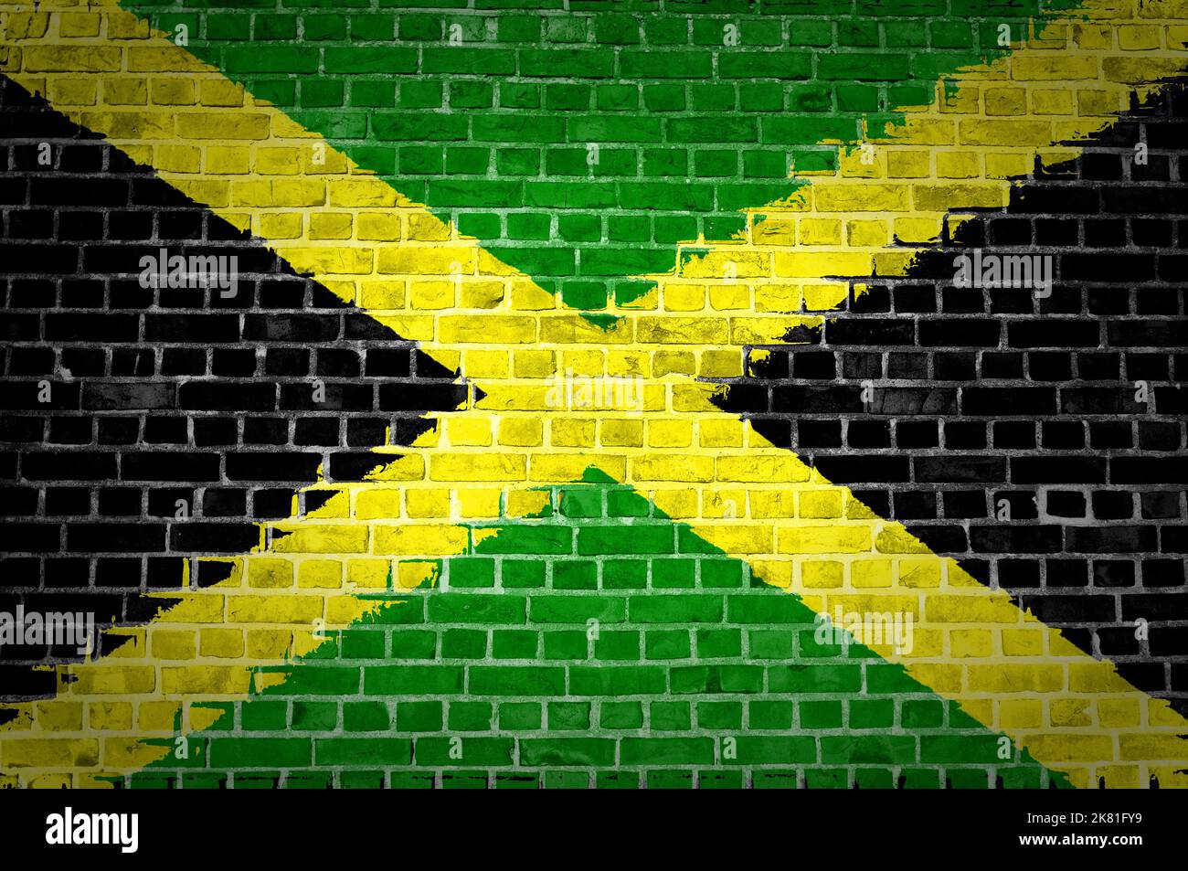 Une image de la Jamaïque drapeau peint sur un mur de briques dans une localisation urbaine Banque D'Images
