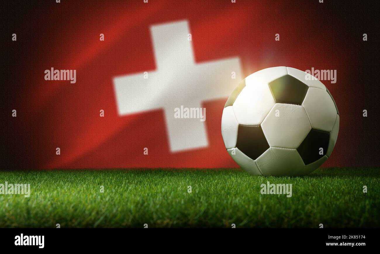 Composition de l'équipe nationale suisse avec ballon classique sur l'herbe et drapeau en arrière-plan. Vue avant. Banque D'Images