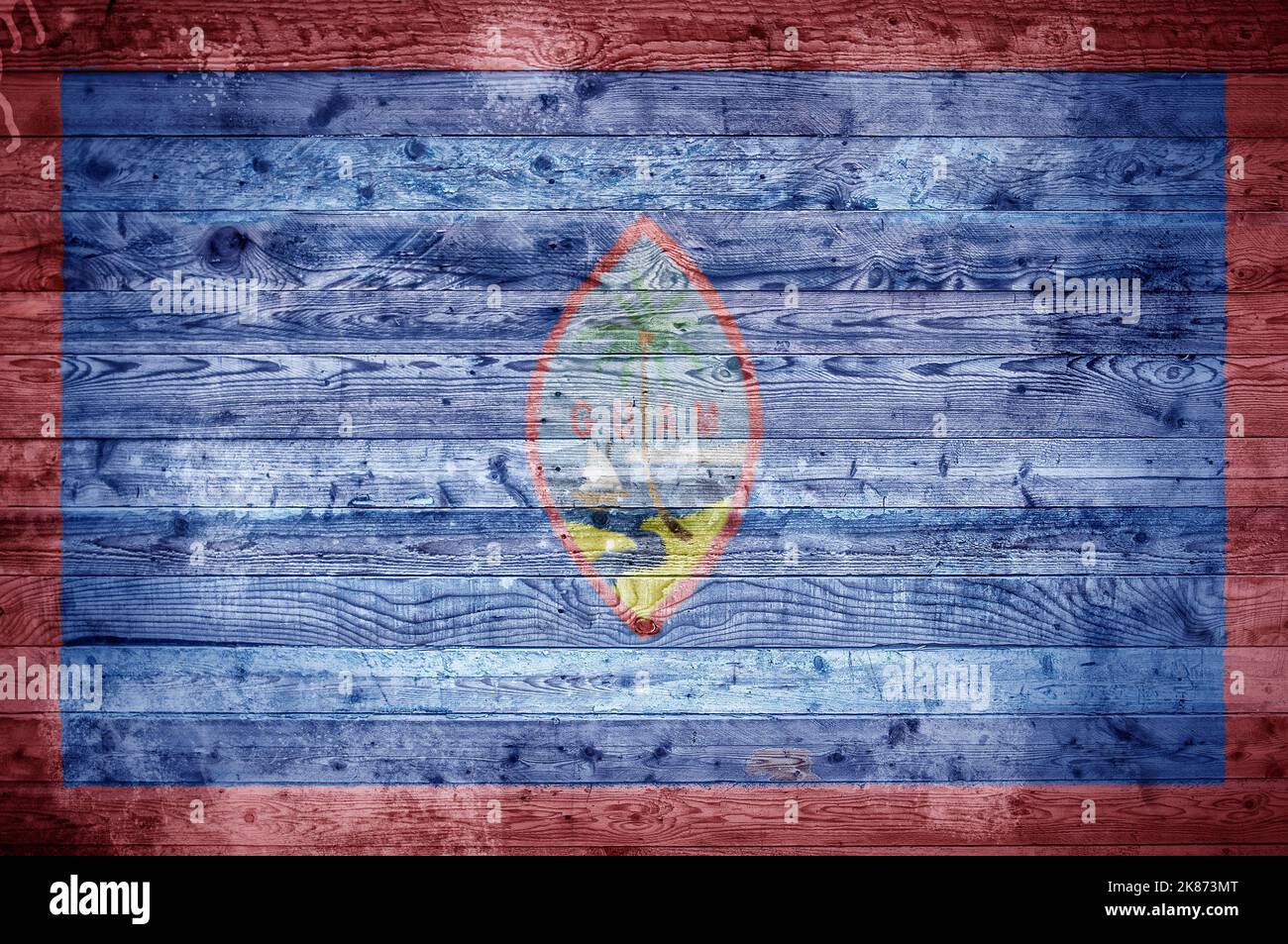 Une vignetted image de fond du drapeau de Guam peints sur des planches de bois d'un mur ou le plancher. Banque D'Images