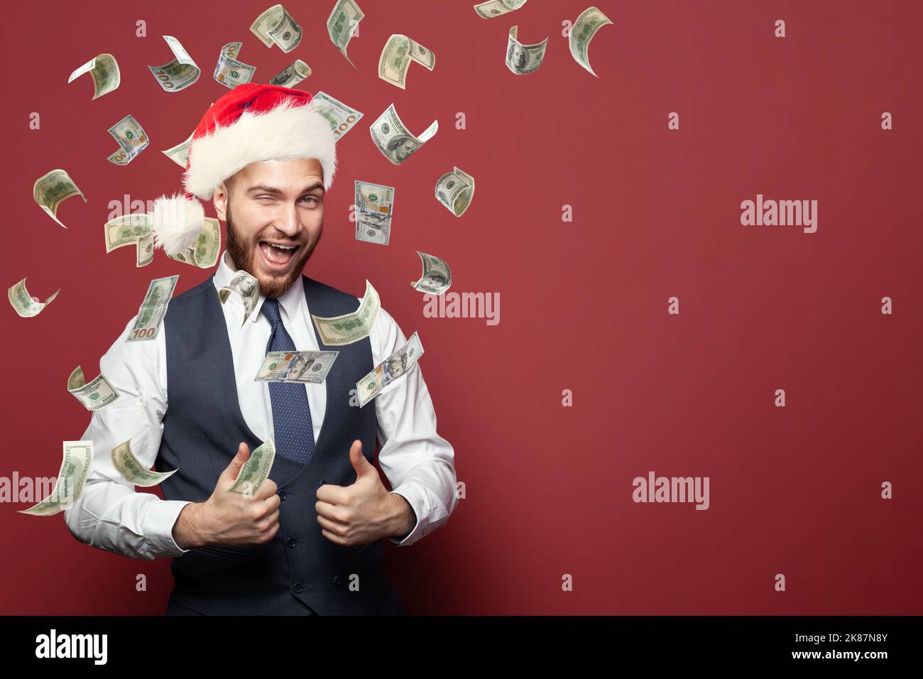 Cadeau de Noël. Homme d'affaires et 100 dollars américains d'argent Banque D'Images