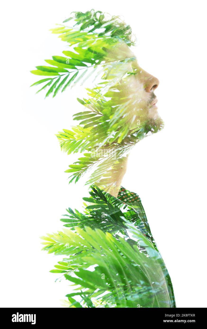 Portrait de profil d'un homme combiné à des plantes tropicales Banque D'Images