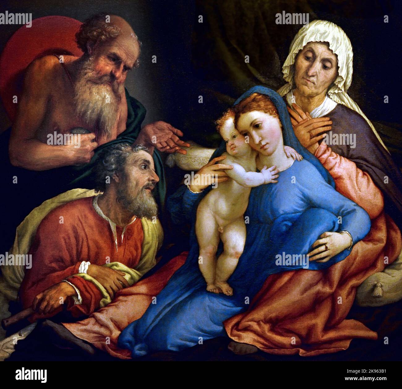 Sainte famille avec St Jérôme, Lorenzo Lotto, (Venezia 1480 - Loreto 1556) , Florence, Italie. ( Sainte Anne, penchée contre la marche sur un lit à baldaquin, avec ses jambes ouvertes, avec la Vierge et le bébé Jésus, entre eux, Saint Jérôme, à gauche, pointant vers la Sainte famille avec sa main ouverte, ) Banque D'Images
