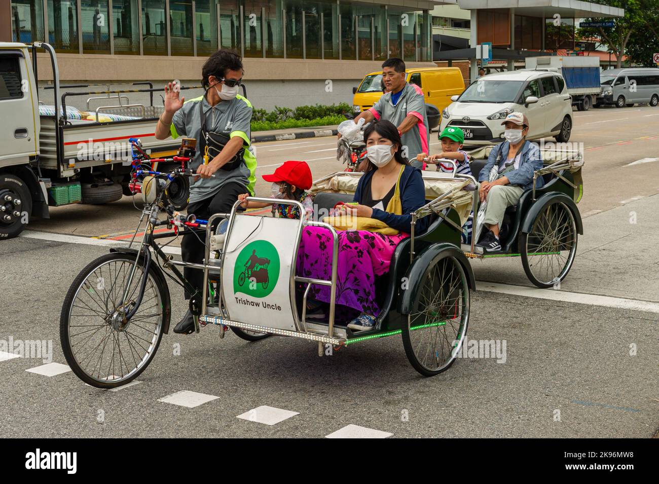 Trishaw Uncle tours pour les touristes sur Jalan Besar, Singapour Banque D'Images