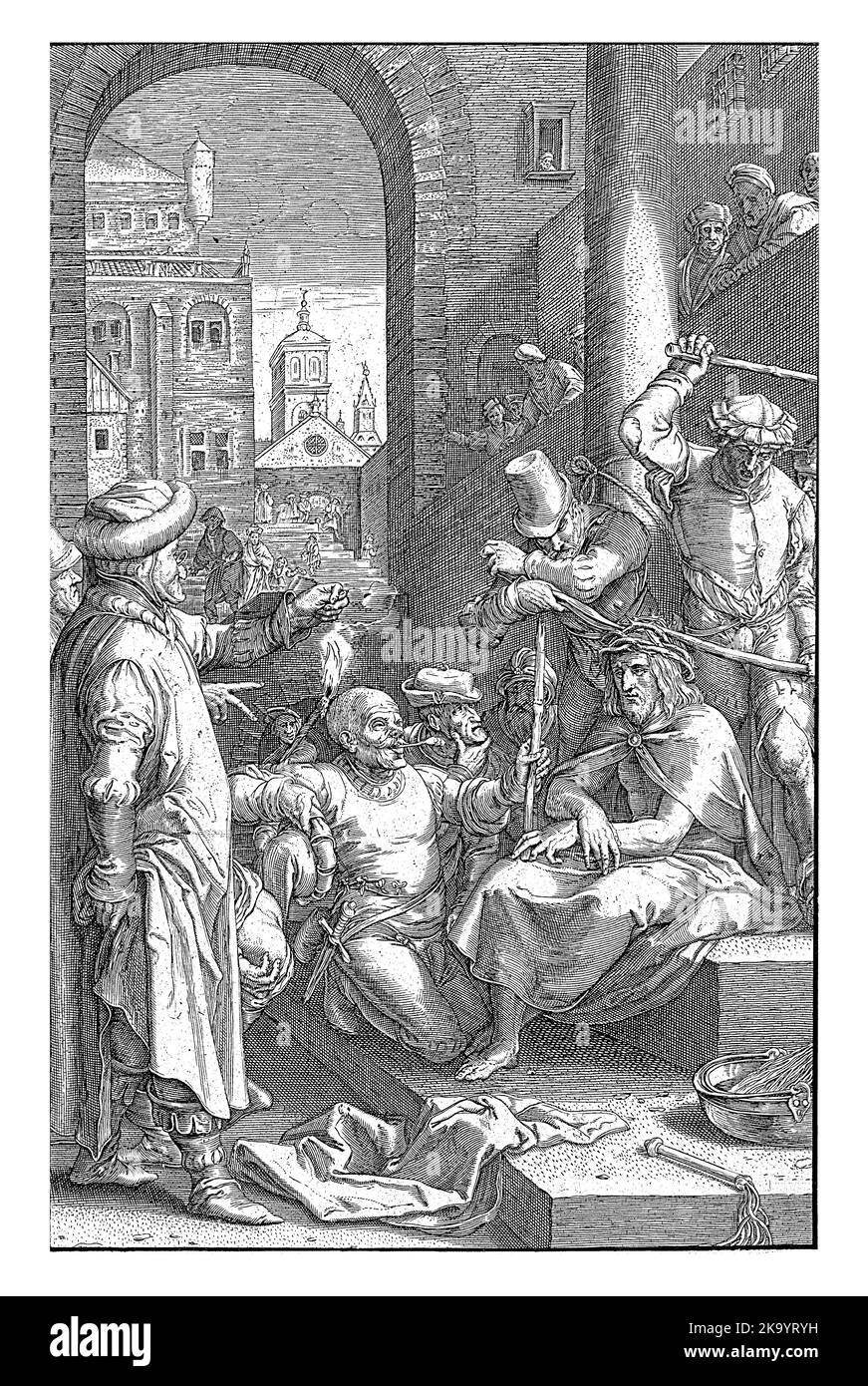 Les hommes poussent une couronne d'épines sur la tête du Christ. Un homme s'agenouille devant lui et lui donne un roseau pour un personnel. Banque D'Images