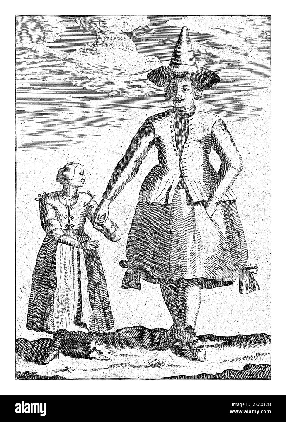 Un agriculteur de Groningen avec sa fille. Le fermier porte un chapeau pointu et une jupe puffy, la fille porte un gilet avec des noeuds. Banque D'Images
