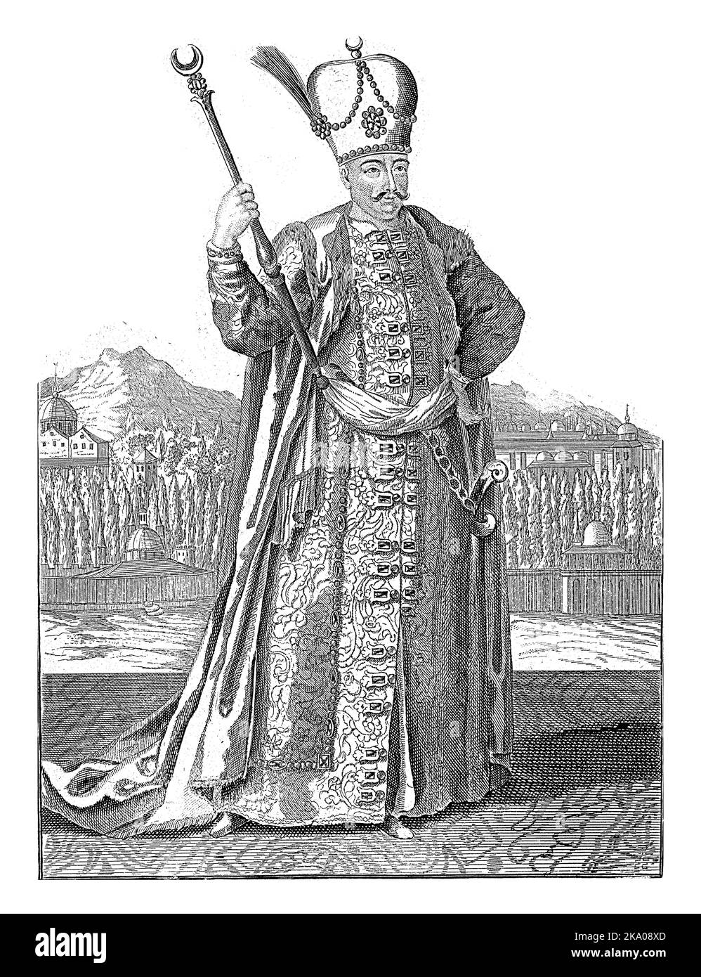 Sultan Mustafa avec un personnel du gouvernement dans sa main et un turban avec un croissant de lune sur sa tête. En arrière-plan une ville avec des bâtiments avec des dômes. Banque D'Images