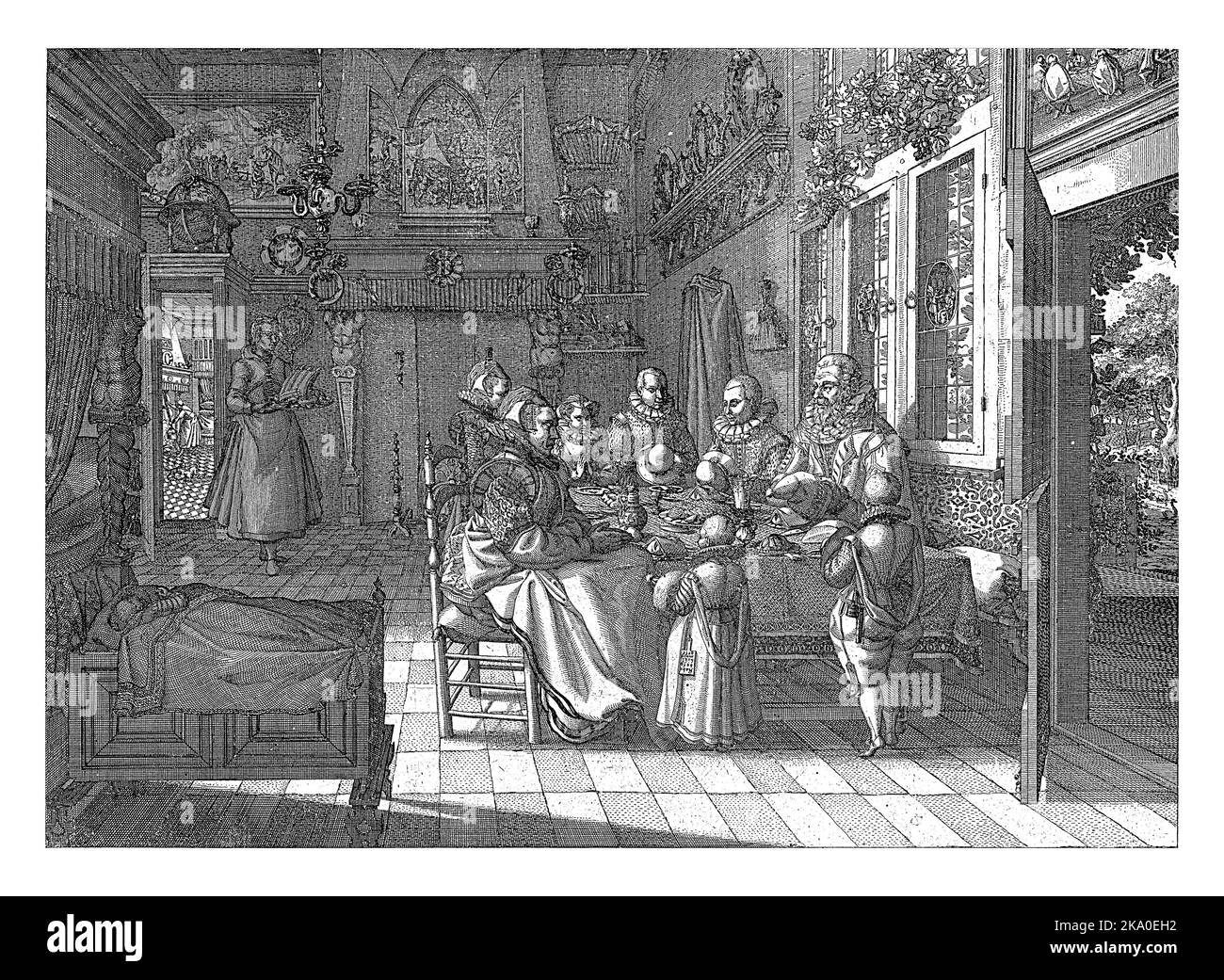 Une famille richement habillée, composée de parents et de six enfants, à une table fixe, priant avant le repas. Les parents et quelques enfants sont assis, t Banque D'Images