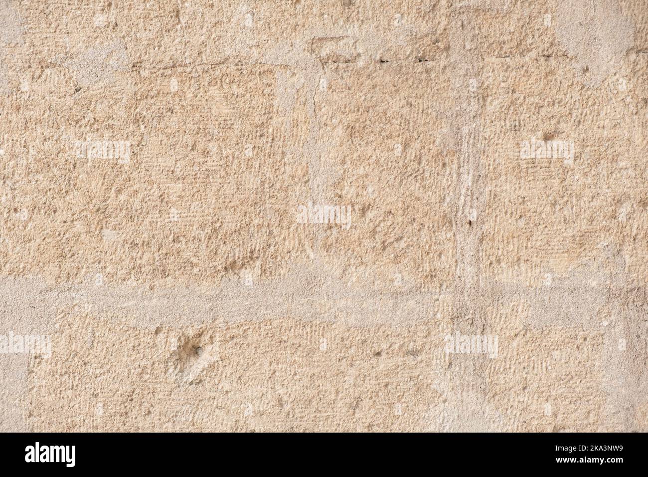 Arrière-plan texturé détaillé du vieux mur en grès avec blocs de couleur jaune clair Banque D'Images