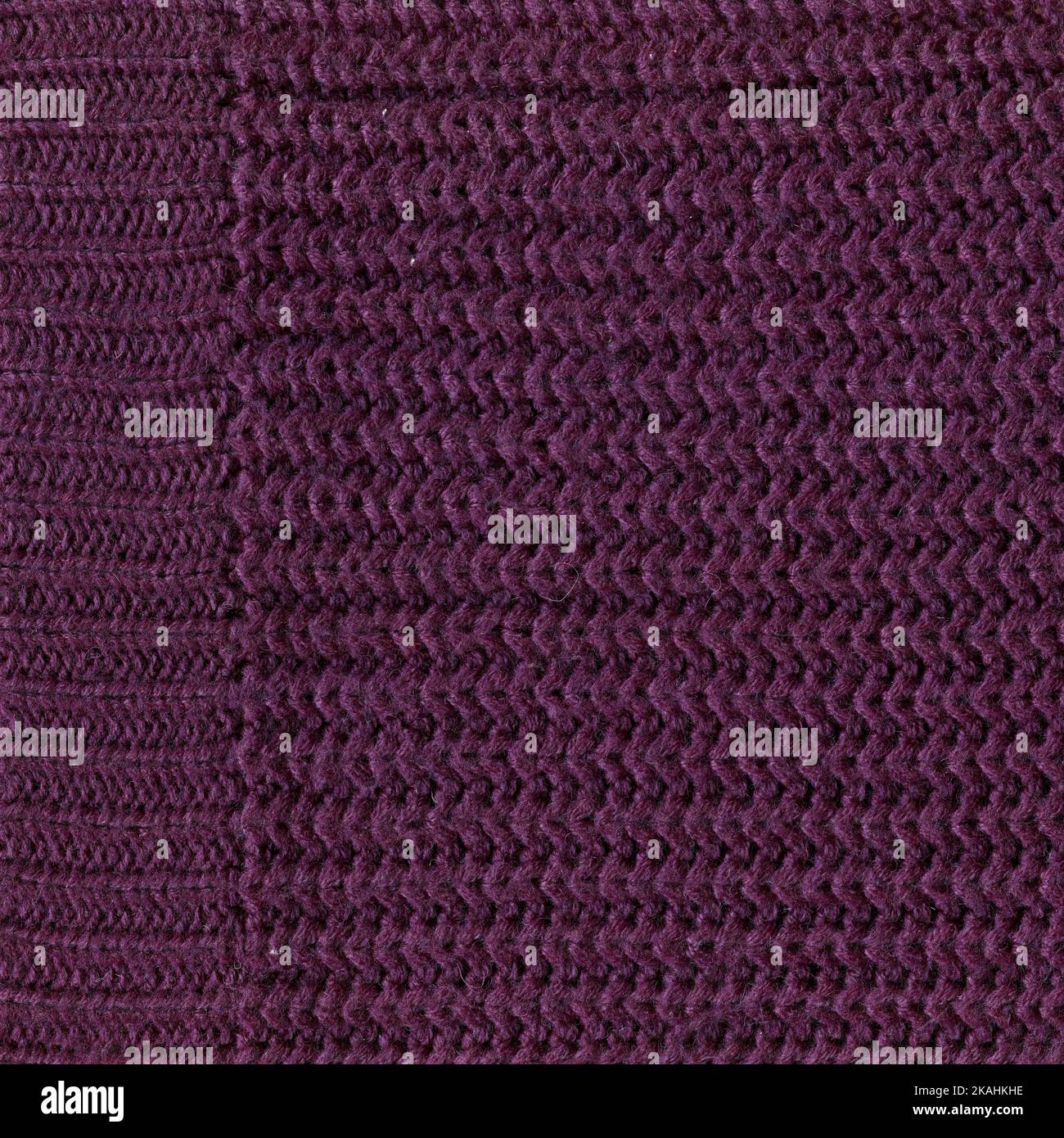 Motif en laine. Tissu tricoté à la main, laine pourpre texture de fond Banque D'Images
