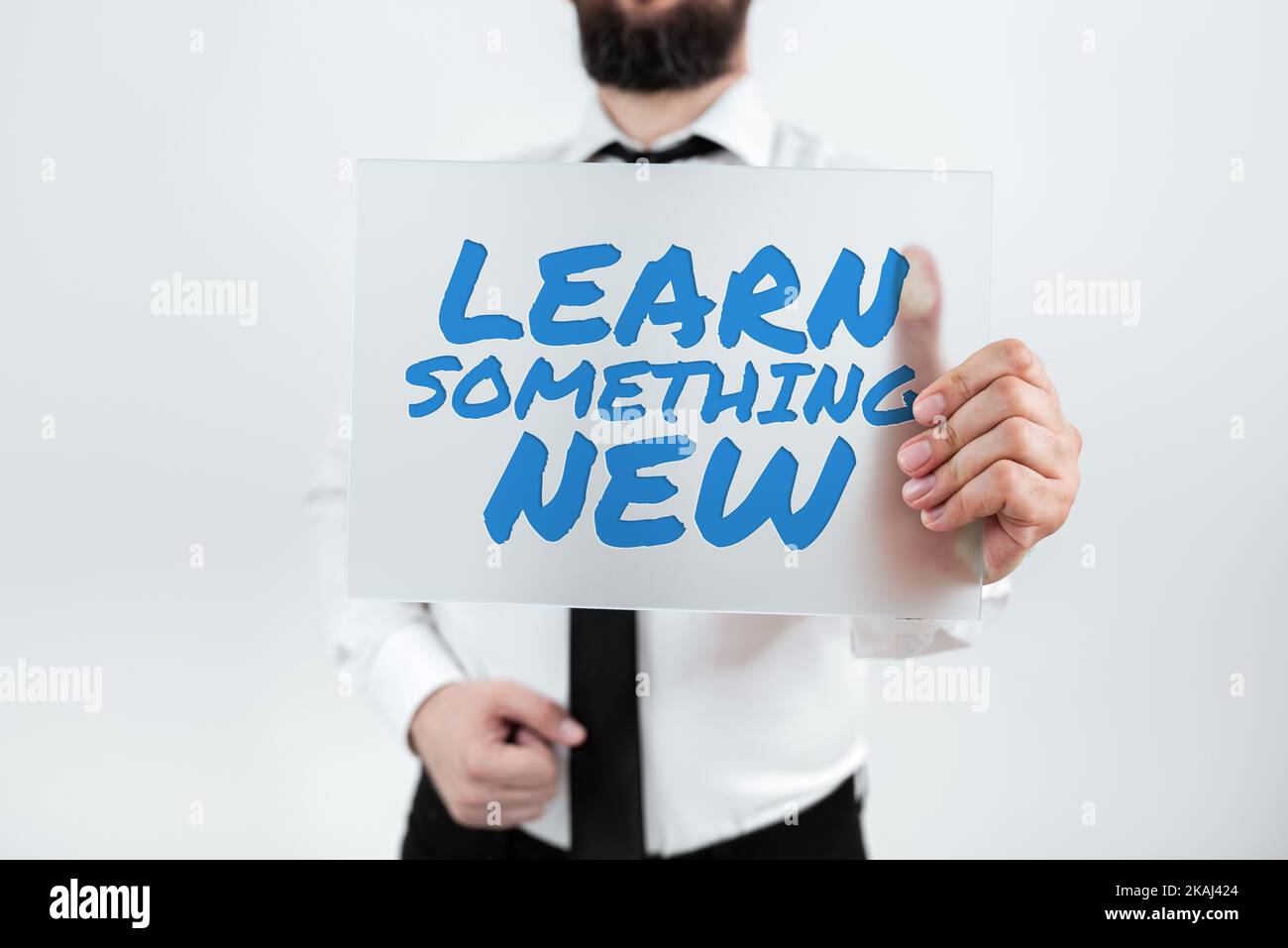 Écriture affichage de texte apprendre quelque chose de nouveau. Concept signification gain acquérir une formation, des connaissances ou des compétences différentes Banque D'Images