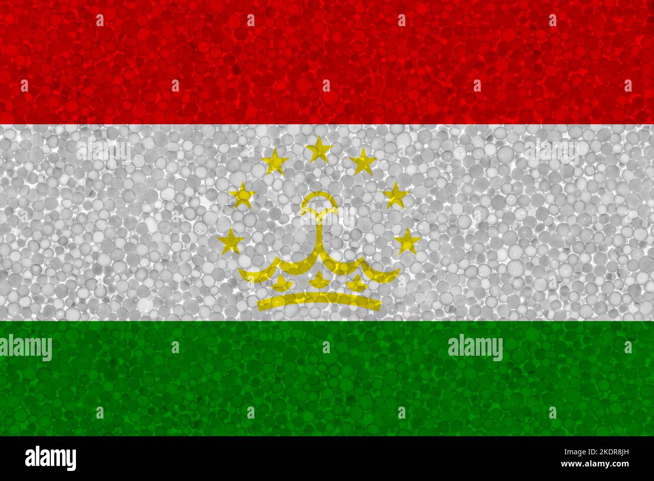 Drapeau du Tadjikistan sur la texture de la styromousse. Drapeau national peint sur la surface de la mousse plastique Banque D'Images