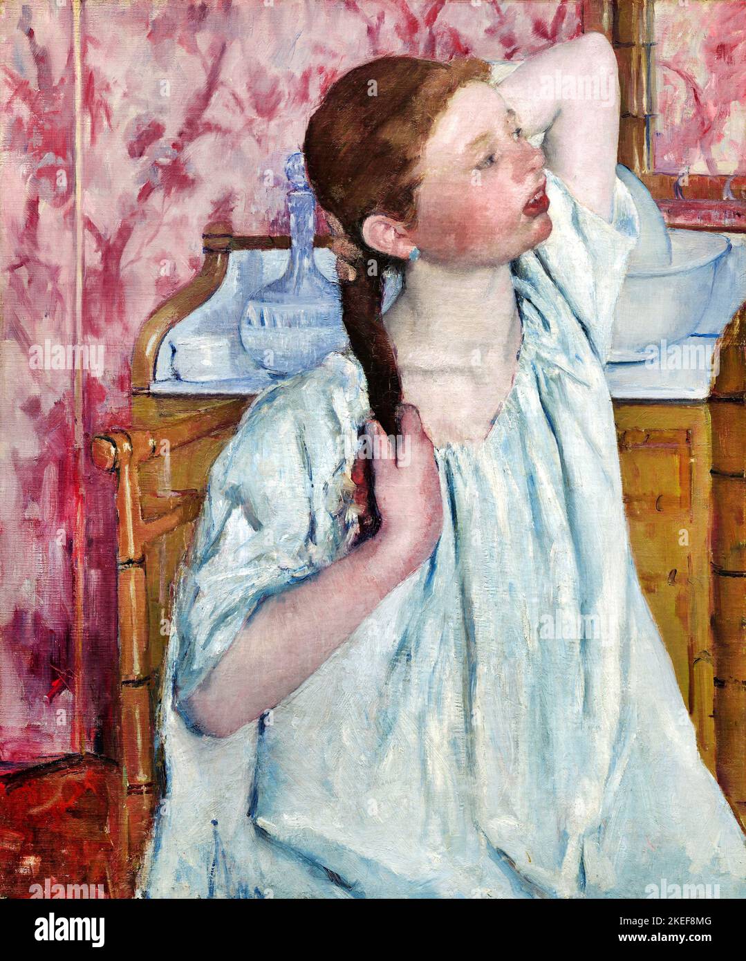 Mary Cassatt, Girl arranger ses cheveux 1886 huile sur toile, National Gallery of Art, Washington, D.C., Etats-Unis. Banque D'Images