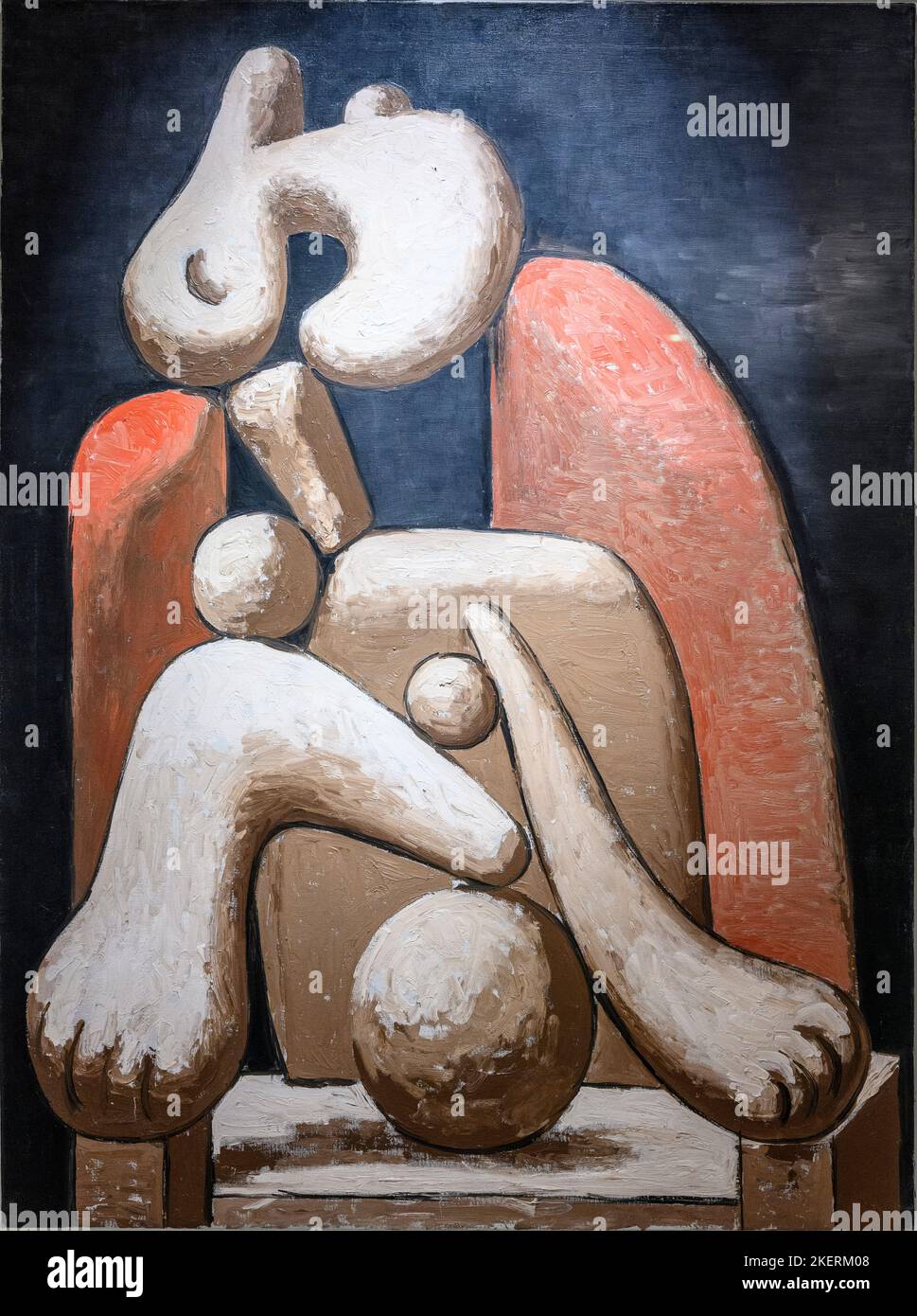 Femme dans une chaise rouge, huile sur toile, 1932, par l'artiste espagnol Pablo Picasso 1881-1973. Banque D'Images