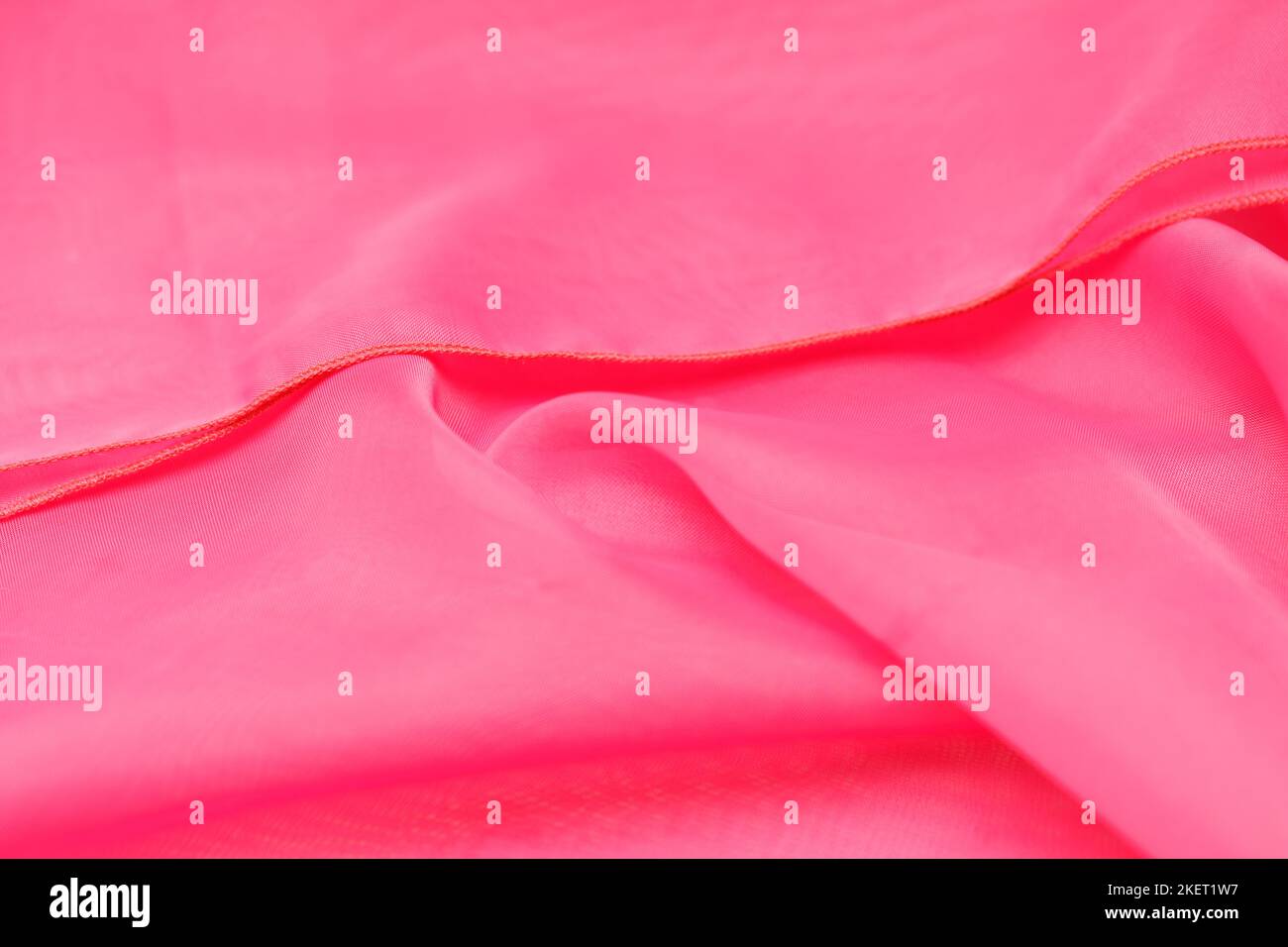 soie rose. tissu ondulé. arrière-plan abstrait pour la conception Banque D'Images