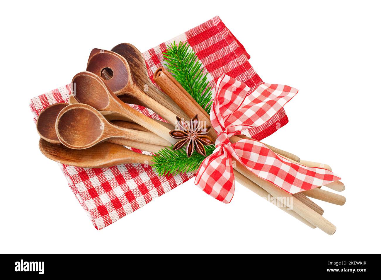 Noël et des cuillères de cuisson en bois avec cannelle, branches de sapin, anis et serviette rouge Banque D'Images