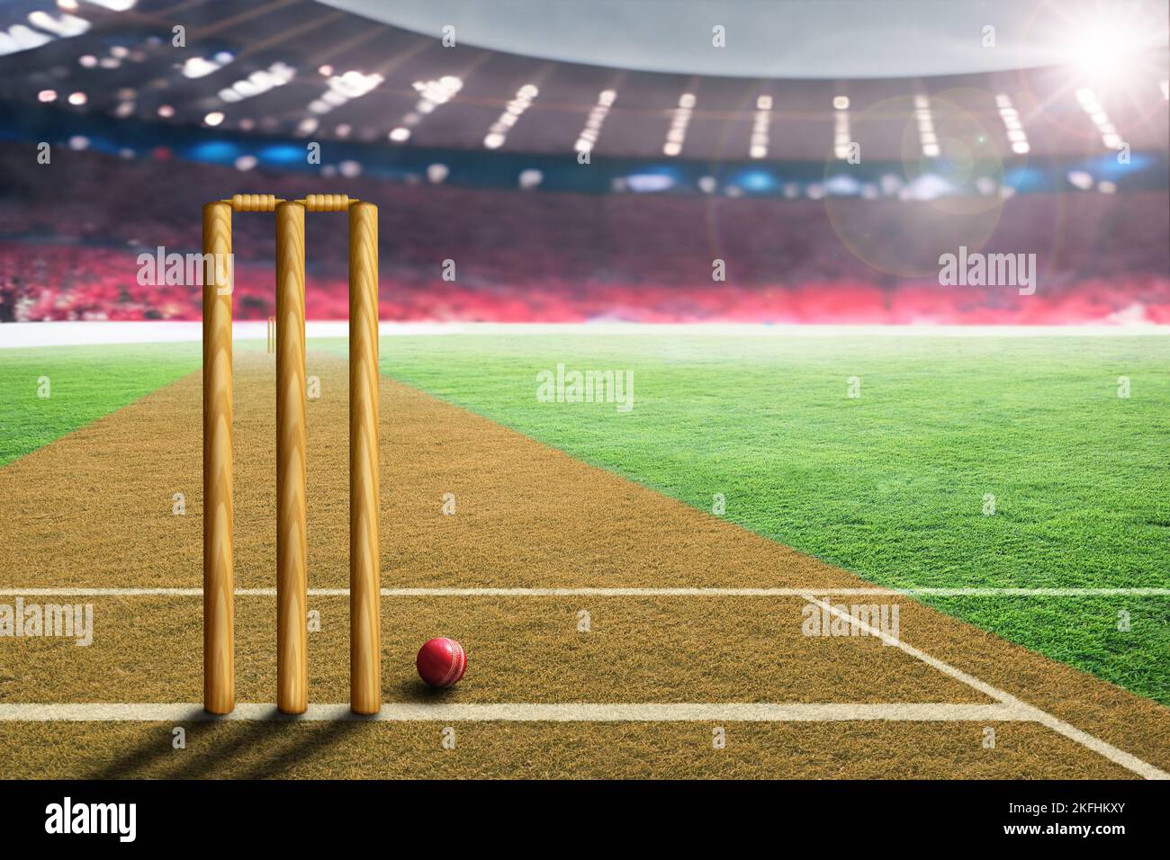 Ballon de cricket en cuir et bickets sur le terrain d'un stade fictif bondé avec des reflets de lentille du soleil et de l'espace de copie. Mise au point sur le premier plan avec un rayon peu profond Banque D'Images