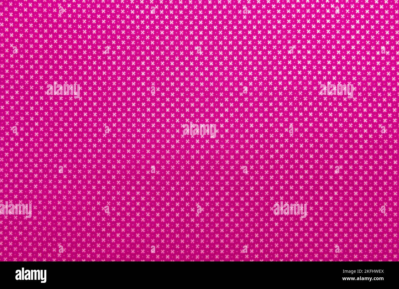 Le tissu. Arrière-plan en tissu rose. Matériel pour coudre des vêtements. Répétition. Texture du tissu Banque D'Images