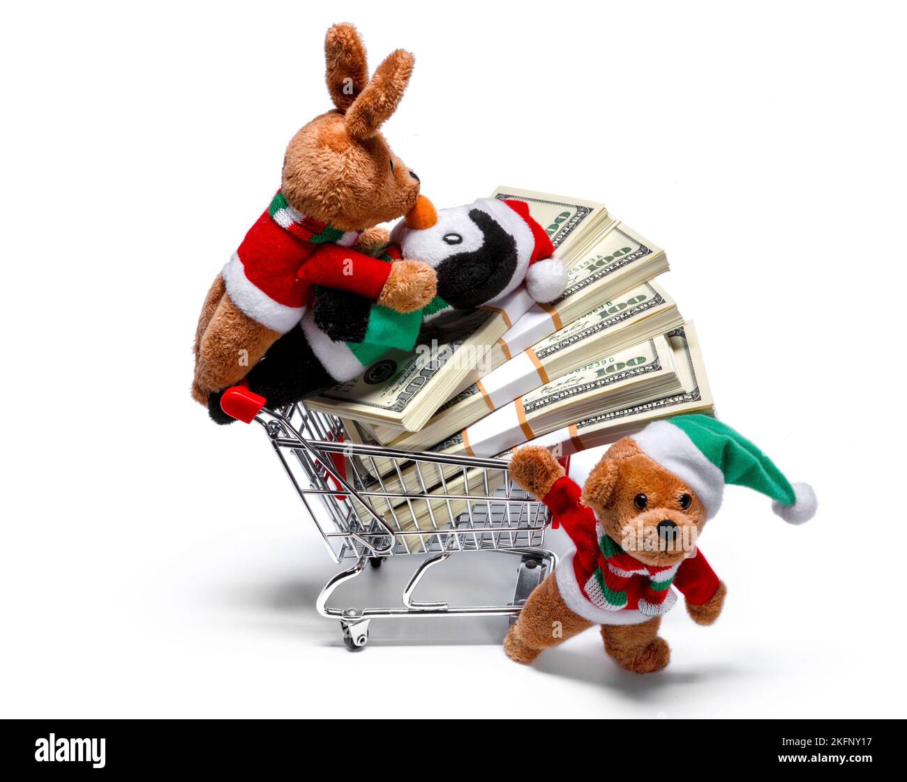 Les aides du Père Noël avec un panier plein d'argent. Concept de Noël amusant Banque D'Images
