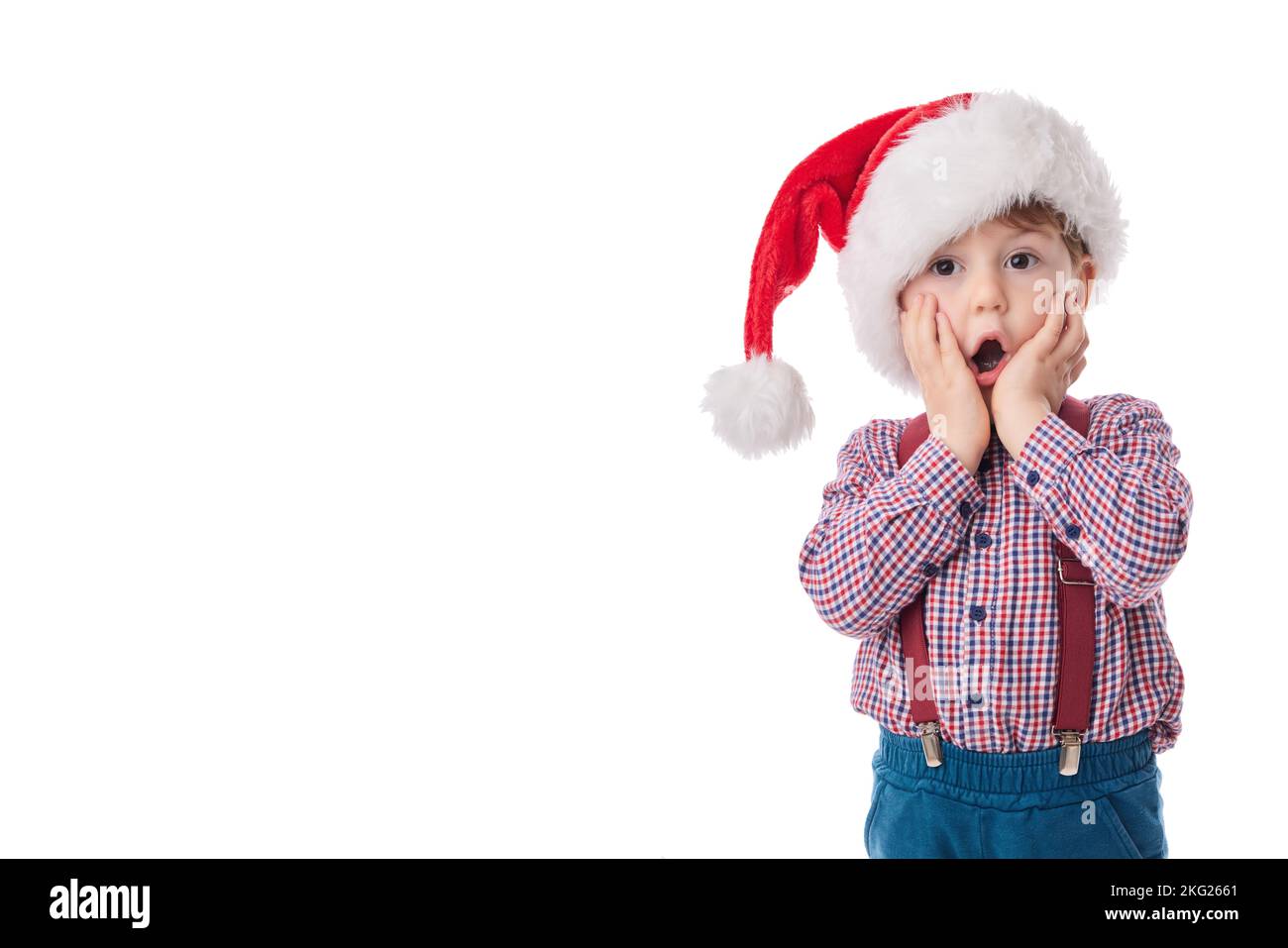 Bon bébé garçon avec cravate et suspension dans le tissu du Père Noël, concept de Noël Banque D'Images