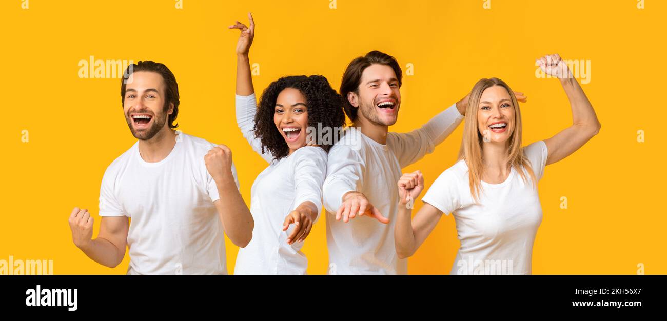 Des jeunes multiraciaux joyeux qui élèvent les mains et applaudisent les poings Banque D'Images