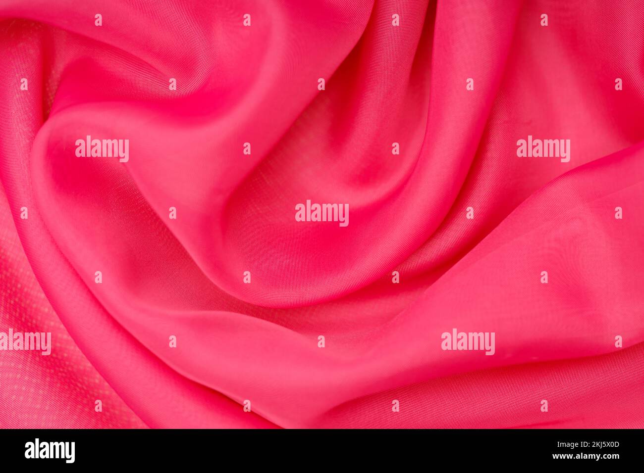 magnifique soie rose. tissu ondulé. Photo de haute qualité Banque D'Images