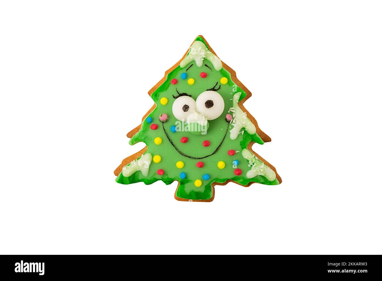 Isolé sur un cookie de Noël blanc dans une forme d'arbre de Noël Banque D'Images