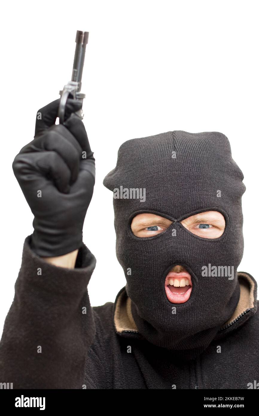 Studio Image d'un bandit portant cagoule pointant son arme vers le ciel au cours d'un hold-up Banque D'Images