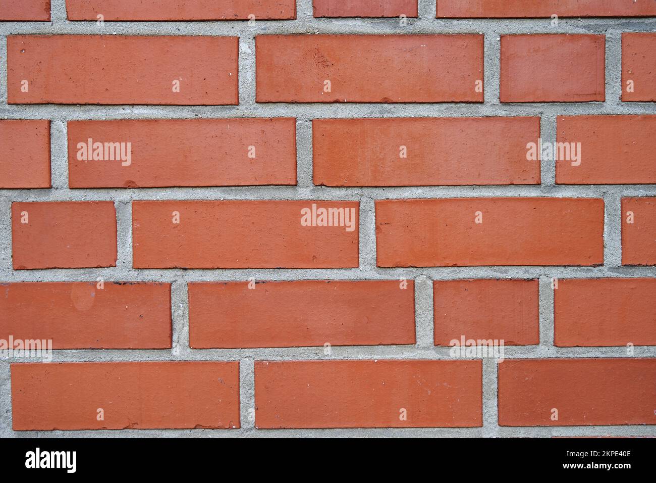 Un fond de texture de mur de brique orange Banque D'Images