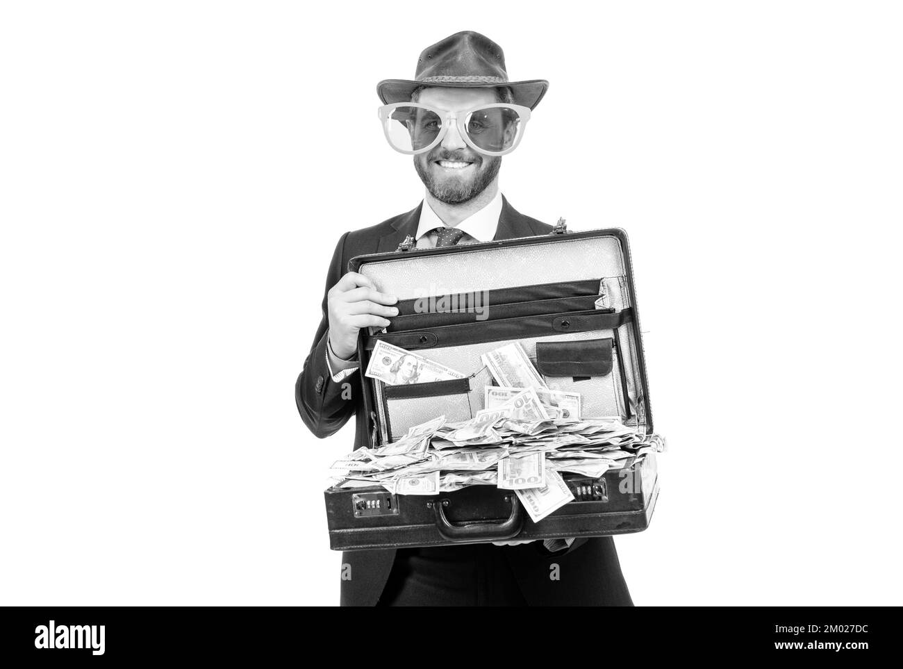 De la chance. Un showman heureux tient sa valise avec des dollars. Investissement pour le retour d'argent. Faire de l'argent. Capital monétaire. Banque D'Images