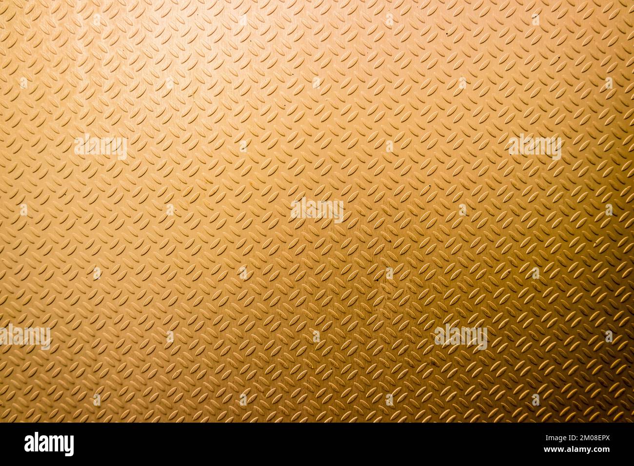 Motif doré d'une plaque d'acier Banque D'Images