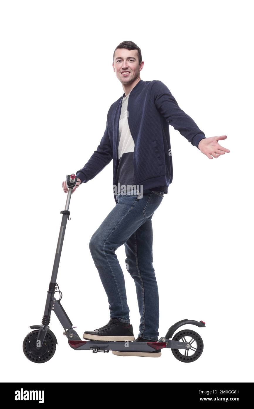 jeune homme souriant avec un scooter électrique . Banque D'Images