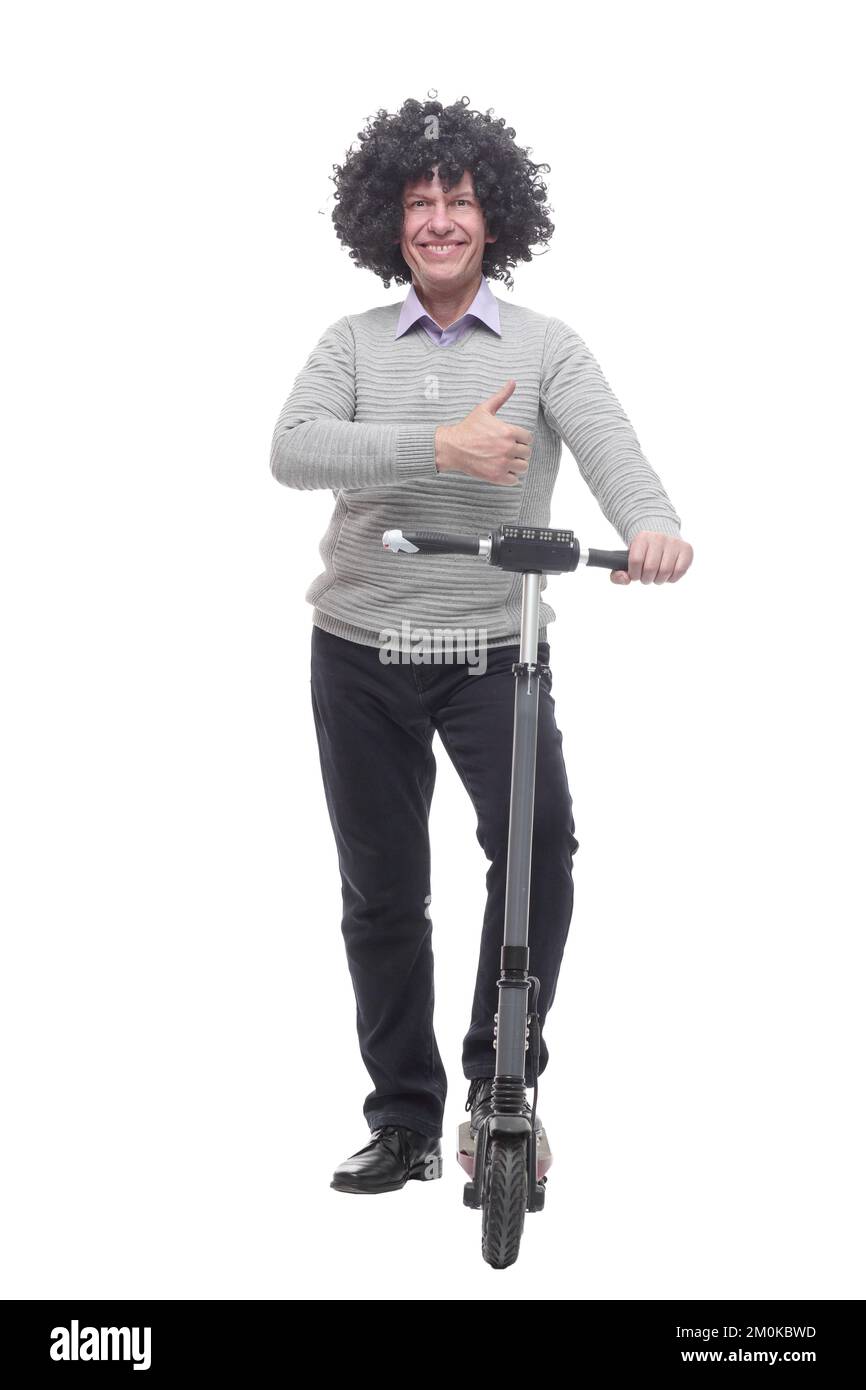 en pleine croissance. homme joyeux avec un scooter électrique. Banque D'Images